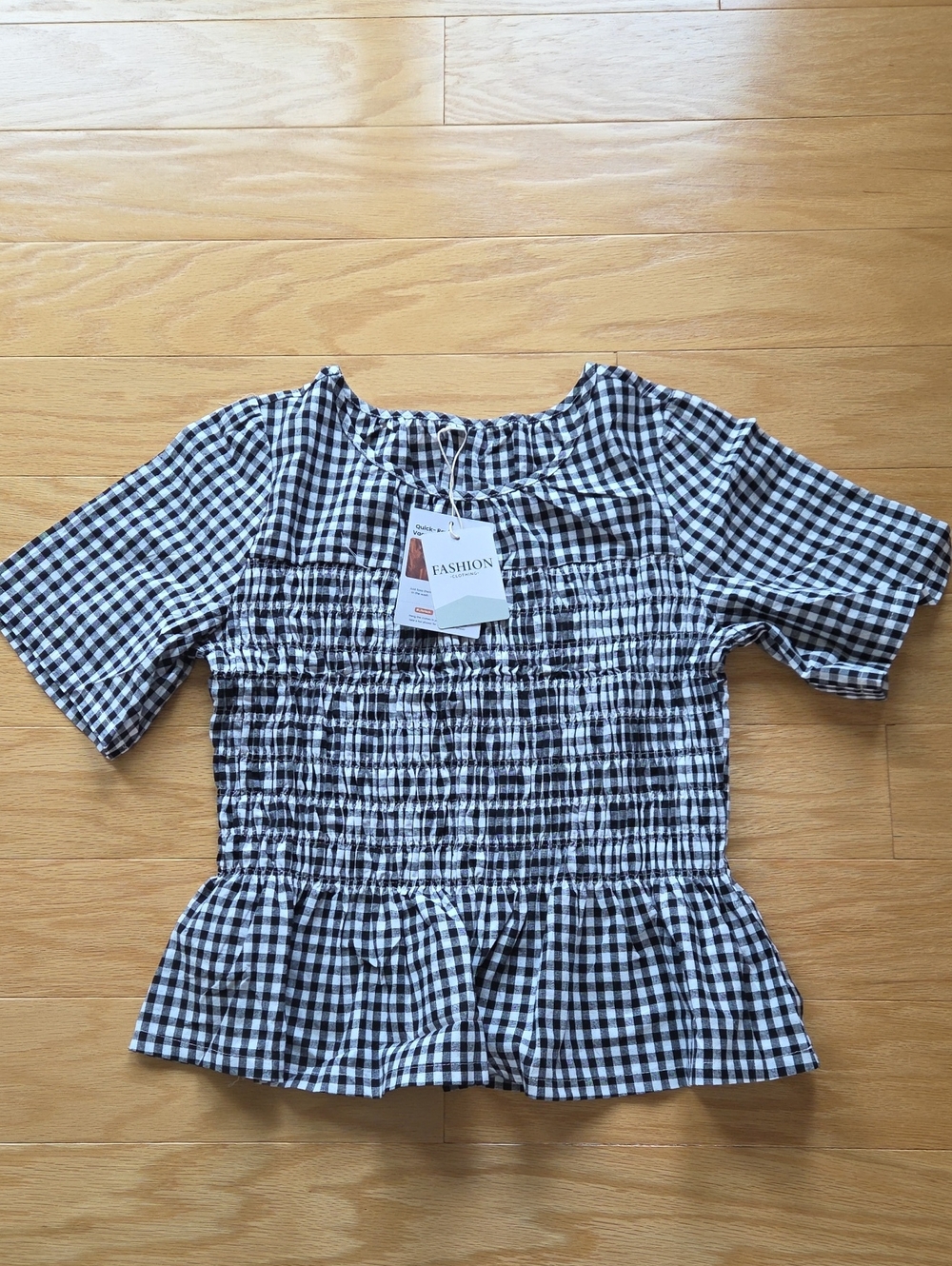 Gingham Smocked Peplum Blouse in Black & White